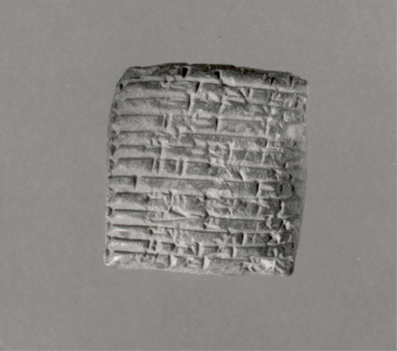 A small palm-sized cuneiform tablet, showing the typical scale of Mesopotamian administrative documents.